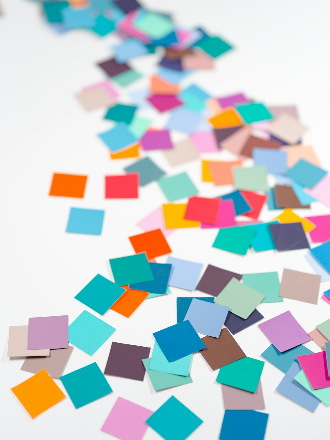 Mastering the First Impression: Your intriguing post title goes here Macro confetti... squares of colorful paper... white background